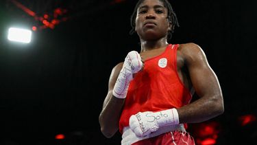 Refugee Olympic Team's Cindy Winner Djankeu Ngamba reacts after beating France's Davina Michel in the women's 75kg quarter-final boxing match during the Paris 2024 Olympic Games at the North Paris Arena, in Villepinte on August 4, 2024. 
MOHD RASFAN / AFP