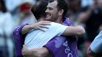 epa11457939 Jamie Murray of Britain (R) hugs his brother Andy Murray (L) after his post match interview following their loss in the Men's doubles 1st round match at the Wimbledon Championships, in Wimbledon, London, Britain, 04 July 2024.  EPA/ADAM VAUGHAN   EDITORIAL USE ONLY