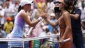 Poland's Iga Swiatek and Japan's Ena Shibahara meet at the net after Swiakek's victory in their women's singles second round tennis match on day four of the US Open tennis tournament at the USTA Billie Jean King National Tennis Center in New York City, on August 29, 2024. 
KENA BETANCUR / AFP