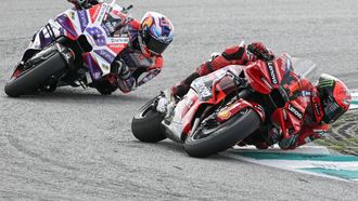 2023-11-12 01:00:00 Ducati Lenovo Team's Italian rider Francesco Bagnaia competes ahead of Prima Pramac's Spanish rider Jorge Martin during the MotoGP Malaysian Grand Prix at the Sepang International Circuit in Sepang on November 12, 2023. 
MOHD RASFAN / AFP