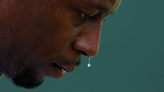 Drops of sweat drip from the nose of France's Gael Monfils as he plays against France's Ugo Humbert during their men's singles first round tennis match on the second day of the 2025 Wimbledon Championships at The All England Lawn Tennis and Croquet Club in Wimbledon, southwest London, on July 1, 2025. 
Adrian Dennis / AFP