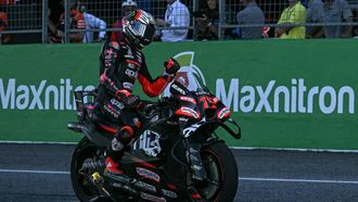 Aprilia Racing's Italian rider Marco Bezzecchi celebrates his victory after crossing the finish line during the MotoGP Thailand Grand Prix at the Buriram International Circuit in Buriram on March 1, 2026. 
Lillian SUWANRUMPHA / AFP