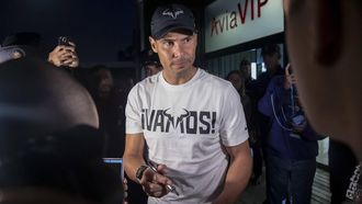 epa11721281 Spanish tennis player Rafael Nadal signs autographs upon arrival at the Malaga airport, Spain, 14 November 2024. Nadal will play for Spain at the upcoming Davis Cup Finals in Malaga.  EPA/Daniel Perez