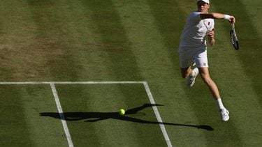 Italy's Jannik Sinner returns against US player Jenson Brooksby during their men's singles third round tennis match on the fifth day of the 2026 Wimbledon Championships at The All England Lawn Tennis and Croquet Club in Wimbledon, southwest London, on July 3, 2026. 
Adrian DENNIS / AFP