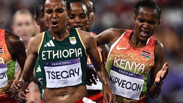 Kenya's Faith Kipyegon and Ethiopia's Gudaf Tsegay compete in the women's 5000m final of the athletics event at the Paris 2024 Olympic Games at Stade de France in Saint-Denis, north of Paris, on August 5, 2024. 
Jewel SAMAD / AFP