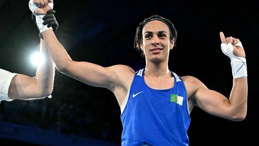 Algeria's Imane Khelif (Blue) reacts after beating Thailand's Janjaem Suwannapheng in the women's 66kg semi-final boxing match during the Paris 2024 Olympic Games at the Roland-Garros Stadium, in Paris on August 6, 2024. 
MOHD RASFAN / AFP