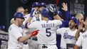 2023-10-27 22:27:54 epa10944087 Texas Rangers Corey Seager (C) is greeted by teammates after hitting a home run during the ninth inning of game one of the Major League Baseball (MLB) World Series between the Texas Rangers and the Arizona Diamondbacks at Globe Life Field in Arlington, Texas, USA, 27 October 2023. The World Series is the best-of-seven games.  EPA/JOHN G. MABANGLO