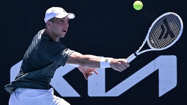 Netherlands' Tallon Griekspoor hits a return against Russia's Roman Safiullin during their men's singles match on day three of the Australian Open tennis tournament in Melbourne on January 16, 2024. 
WILLIAM WEST / AFP