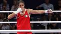 epa11522743 Imane Khelif of Algeria (red) celebrates winning over Anna Luca Hamori of Hungary (blue) in their Women 66kg Quarterfinal bout of the Boxing competitions in the Paris 2024 Olympic Games, at the North Paris Arena in Villepinte, France, 03 August 2024.  EPA/ALI HAIDER