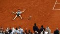 epa12164570 Carlos Alcaraz of Spain celebrates winning his Men's final match against Jannik Sinner of Italy at the French Open Grand Slam tennis tournament at Roland Garros in Paris, France, 08 June 2025.  EPA/YOAN VALAT