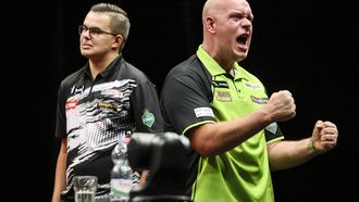 epa11619981 Michael van Gerwen (R) of The Netherlands celebrates after he won against his compatriot, Gian van Veen (L) in the final of the PDC European Tour Hungarian Darts Trophy in MVM Dome in Budapest, Hungary, 22 September 2024.  EPA/Robert Hegedus HUNGARY OUT