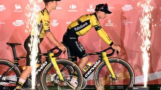 Team Visma-Lease a bike's Danish rider Jonas Vingegaard (R) rides his bike on stage during the official teams presentation of the 80th edition of 'La Vuelta' cycling tour of Spain, in Torino, Italy on August 21, 2025. 
Marco BERTORELLO / AFP