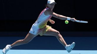 Poland's Iga Swiatek hits a return against Slovakia’s Rebecca Sramkova during their women's singles match on day five of the Australian Open tennis tournament in Melbourne on January 16, 2025. 
DAVID GRAY / AFP