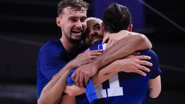 epa11542362 (L-R) Jean Patry, Earvin Ngapeth and Antoine Brizard of France celebrates after winning the Men's Gold Medal Match between France and Poland of the Volleyball competitions in the Paris 2024 Olympic Games, at the South Paris Arena in Paris, France, 10 August 2024.  EPA/RITCHIE B. TONGO