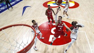 2023-09-08 22:23:22 epa10848654 Andreas Obst #42 of Germany drives to the basket against Tyrese Haliburton #4 (L) and Jaren Jackson Jr. 
 of the United States in the fourth quarter during the FIBA Basketball World Cup semifinal game at the Mall of Asia in Manila, Philippines, 08 September 2023.  EPA/Yong Teck Lim / POOL