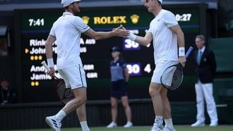 epa11457880 Andy Murray (R) and Jamie Murray (L) of Britain interact as they play against John Peers and Rinky Hijikata of Australia (both unseen) during their Men's doubles 1st round match at the Wimbledon Championships, in Wimbledon, London, Britain, 04 July 2024.  EPA/ADAM VAUGHAN   EDITORIAL USE ONLY