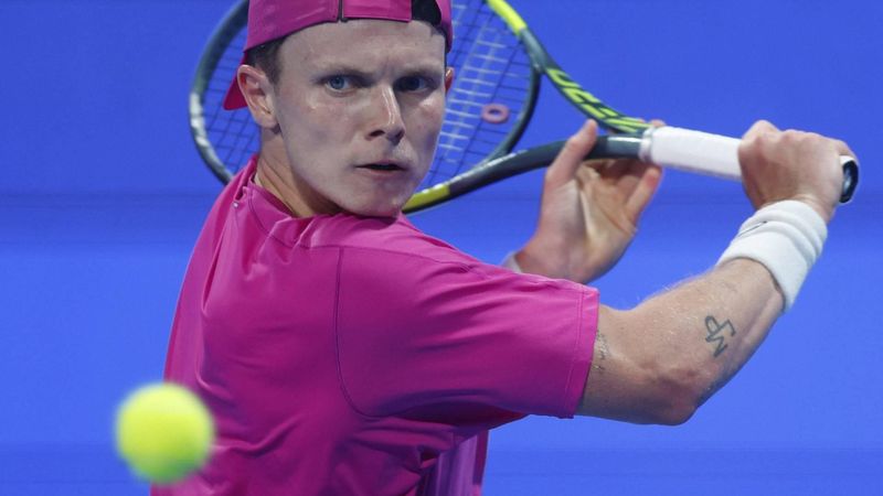 Netherlands’ Jesper De Jong hits a return against Russia's Andrey Rublev during their men’s singles match at the Qatar Open tennis tournament in Doha on February 17, 2026. 
Karim JAAFAR / AFP