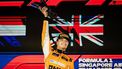 epa11619155 British driver Lando Norris of McLaren F1 Team celebrates on the podium after winning the Singapore Formula One Grand Prix at the Marina Bay Street Circuit, Singapore, 22 September 2024.  EPA/TOM WHITE
