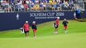 US teams golfer Megan Khang (R) and US teams golfer Lauren Coughlin (2L) stand with their caddies during play in their fourball match against Team Europe players on the second day of the 2026 Solheim Cup biennial team golf competition on The Bernardus Golf Course at Cromvoirt, some 80kms south-east of Rotterdam on September 12, 2026.  
NICOLAS TUCAT / AFP