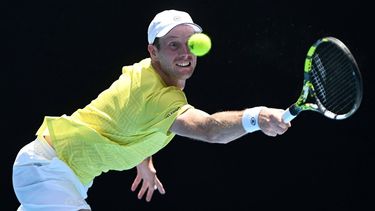 epa11075097 Botic van de Zandschulp of Netherlands returns during his first round match against Jannik Sinner of Italy on Day 1 of the 2024 Australian Open at Melbourne Park in Melbourne, Australia, 14 January 2024.  EPA/LUKAS COCH AUSTRALIA AND NEW ZEALAND OUT