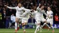 Real Madrid's French forward #09 Kylian Mbappe (L) and Real Madrid's Spanish defender #35 Raul Asencio celebrate with teammates after winning in a penalty shootout the UEFA Champions League Round of 16 second leg football match between Club Atletico de Madrid and Real Madrid CF at the Metropolitano stadium in Madrid on March 12, 2025. 
OSCAR DEL POZO / AFP