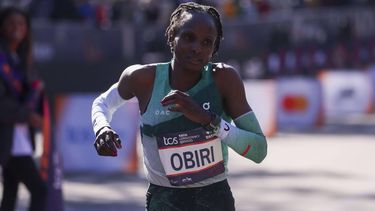 epa11699358 Kenya's Hellen Obiri crosses the finish line to win second place in the women's pro open race during the 2024 New York City Marathon in New York, New York, USA, 03 November 2024.  EPA/SARAH YENESEL