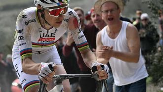 Team UAE's slovenain rider Tadej Pogacar rides as he sustains an injury on his arm after a crash during the 19th one-day classic Strade Bianche (White Roads) men's cycling race between Siena and Siena in Tuscany on March 8, 2025. 
Marco BERTORELLO / AFP