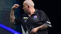 epa09954410 Phil Taylor of Great Britain in action against Devon Petersen of South Africa during the Hungarian Darts Show at the MVM Dome in Budapest, Hungary, 17 May 2022 (issued 18 May 2022).  EPA/Tibor Illyes HUNGARY OUT