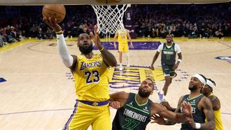 epa12066439 Los Angeles Lakers' LeBron James (L) lays up the ball during the first half of the NBA playoffs round one game five between the Minnesota Timberwolves and the Los Angeles Lakers in Los Angeles, California, USA, 30 April 2025.  EPA/ALLISON DINNER SHUTTERSTOCK OUT