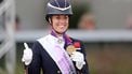epa09461572 Charlotte Dujardin of Great Britain riding Gio celebrates the third place after the Grand Prix Freestyle Individual competition during the FEI Dressage European Championship in Hagen am Teutoburger Wald, Germany, 11 September 2021.  EPA/FRIEDEMANN VOGEL