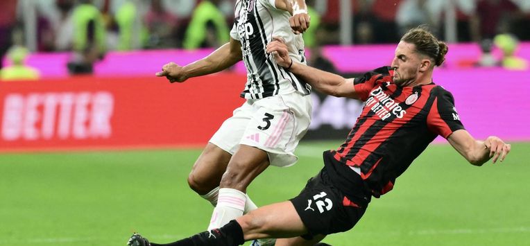 Juventus' Brazilian defender #03 Bremer (L) fights for the ball with AC Milan's French midfielder #12 Adrien Rabiot during the Italian Serie A football match between AC Milan and Juventus FC at the San Siro stadium in Milan, northern Italy, on April 26, 2026. 
Stefano RELLANDINI / AFP
