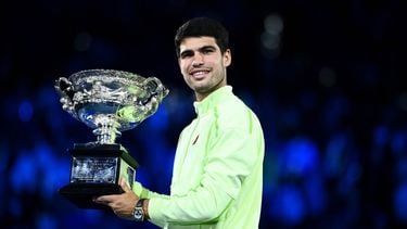 epa12697298 Carlos Alcaraz of Spain poses with the trophy after winning the Men’s Singles final match against Novak Djokovic of Serbia at the Australian Open tennis tournament in Melbourne, Australia, 01 February 2026.  EPA/JOEL CARRETT AUSTRALIA AND NEW ZEALAND OUT