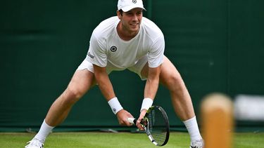 Netherlands' Botic Van De Zandschulp waits for the service from France's Ugo Humbert during their men's singles second round tennis match on the third day of the 2024 Wimbledon Championships at The All England Lawn Tennis and Croquet Club in Wimbledon, southwest London, on July 3, 2024. 
Ben Stansall / AFP