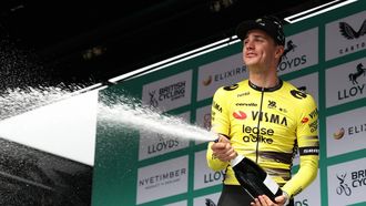 Team Visma Lease a Bike's Dutch rider Olav Kooij sprays the champagne on the podium as he celebrates winning the sixth stage of the Tour of Britain cycling race, in Cardiff on September 7, 2025. 
Darren Staples / AFP
