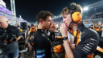 epa12559959 McLaren driver Lando Norris of Britain (L) talks with his race engineer Will Joseph in the starting grid prior the Formula 1 Qatar Grand Prix at the Lusail International Circuit racetrack outside Doha, Qatar, 30 November 2025.  EPA/ALI HAIDER