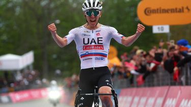 Team UAE's Slovenian rider Tadej Pogacar celebrates as he crosses the finish line to win the 2nd stage of the 107th Giro d'Italia cycling race, 161km between San Francesco al Campo and Sanctuary of Oropa (Biella), on May 5, 2024 in Biella.  
Luca Bettini / AFP