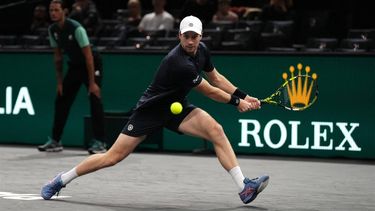 2023-11-02 12:54:29 Netherlands' Botic van de Zandschulp plays a backhand return to Andrey Rublev during their men's singles match on day four of the Paris ATP Masters 1000 tennis tournament at the Accor Arena - Palais Omnisports de Paris-Bercy - in Paris on November 2, 2023. 
Dimitar DILKOFF / AFP