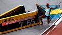 First-placed Bahamas' Devynne Charlton poses next to the score board reading her world record after winning the Women's 60m hurdles final during the Indoor World Athletics Championships in Glasgow, Scotland, on March 3, 2024. 
Anne-Christine POUJOULAT / AFP