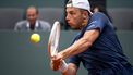 Netherlands' Tallon Griekspoor plays a backhand return to Serbia's Novak Djokovic during their ATP 250 Geneva Open tennis tournament single quarter final match, in Geneva on May 23, 2024. 
Fabrice COFFRINI / AFP