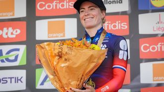 epa12059003 Third placed Dutch Demi Vollering of team FDJ - SUEZ celebrates on the podium for the Liege Bastogne Liege cycling classic race for Elite Women over 152,9 km from Bastogne to Liege, Belgium, 27 April 2025.  EPA/OLIVIER MATTHYS