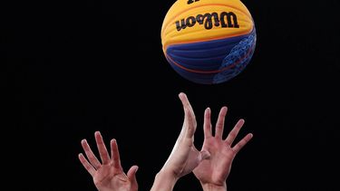 China's #11 Chen Mingling and US' #05 Dearica Hamby fights for the ball in the women's 3x3 basketball play-in games during the Paris 2024 Olympic Games at La Concorde in Paris on August 3, 2024. 
David GRAY / AFP