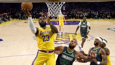 epa12066439 Los Angeles Lakers' LeBron James (L) lays up the ball during the first half of the NBA playoffs round one game five between the Minnesota Timberwolves and the Los Angeles Lakers in Los Angeles, California, USA, 30 April 2025.  EPA/ALLISON DINNER SHUTTERSTOCK OUT