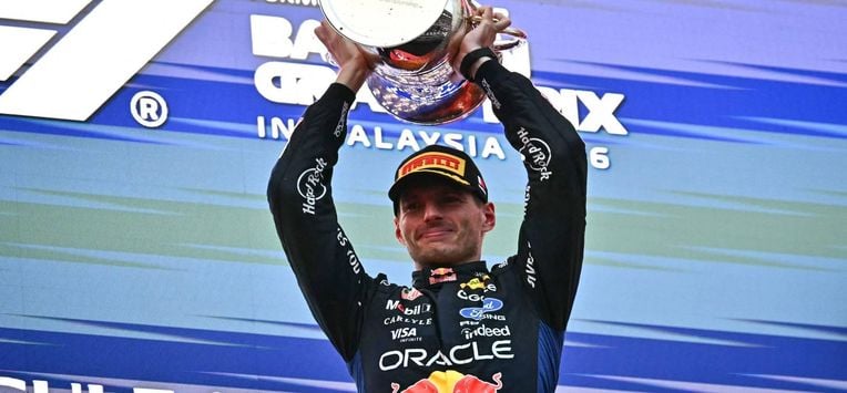 Race winner Red Bull Racing's Dutch driver Max Verstappen lifts his trophy during podium ceremony of the Formula One Bahrain Grand Prix in Sepang on October 4, 2026. 
Lillian SUWANRUMPHA / AFP