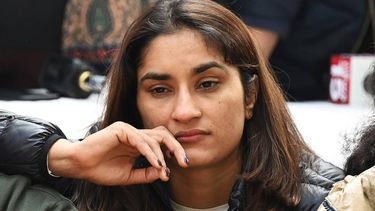 Indian wrestler Vinesh Phogat along with others wrestlers takes part in an ongoing protest against the Wrestling Federation of India (WFI), in New Delhi on January 19, 2023, following allegations of sexual harassment to athletes by members of the WFI. Triple Commonwealth Games gold medallist Vinesh Phogat, one of India's most decorated women wrestlers, has accused her federation chief and several coaches of sexually harassing multiple athletes. 
Sajjad HUSSAIN / AFP