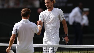 Britain's Arthur Fery (L) congratulates Germany's Alexander Zverev for winning their men's singles semi-final tennis match on the twelfth day of the 2026 Wimbledon Championships at The All England Lawn Tennis and Croquet Club in Wimbledon, southwest London, on July 10, 2026. 
Adrian DENNIS / AFP