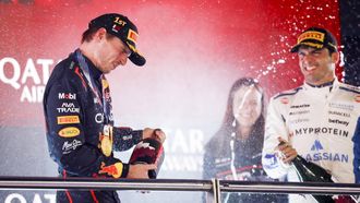 DOHA - Max Verstappen (Red Bull Racing) op het podium samen met Carlos Sainz (Williams) en Hannah Schmitz (hoofdingenieur strategie van Red Bull Racing) na het winnen van de Qatar Grand Prix op het Lusail International Circuit. ANP SANDER KONING