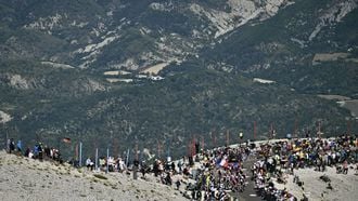Riders cycle in the ascent of Mont Ventoux during the 16th stage of the 112th edition of the Tour de France cycling race, 171.5 km between Montpellier and Mont Ventoux, southern France, on July 22, 2025. 
Marco BERTORELLO / AFP