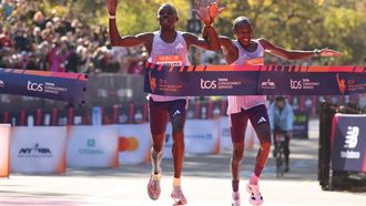 Kenyans Benson Kipruto (L) and Alexander Mutiso celebrate taking first and second place respectively in the New York Marathon in New York on November 2, 2025. 
CHARLY TRIBALLEAU / AFP