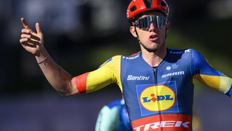 epa11300601 Thibau Nys from Belgium of team Lidl-Trek raises his arms after crossing the finish line to win the second stage, a 171,02 km race between Fribourg and Salvan / Les Marecottes at the 77th Tour de Romandie UCI World Tour Cycling race, in Salvan, Switzerland, 25 April 2024.  EPA/LAURENT GILLIERON