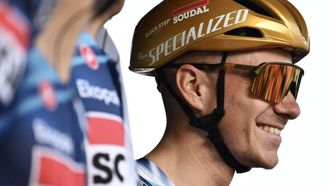 Soudal Quick-Step’s Belgian rider Remco Evenepoel looks on from the sign-in podium ahead of the 119th edition of the Giro di Lombardia (Tour of Lombardy), a 238km cycling race from Como to Bergamo on October 11, 2025. 
Marco BERTORELLO / AFP